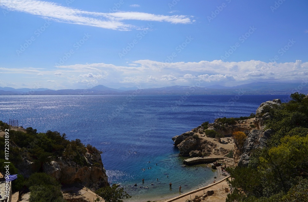 Fototapeta premium View of the Heraion archaeological site with people swimming in its harbor