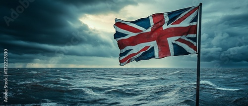 UK flag waves in stormy sea. Dramatic ocean backdrop.  Patriotic imagery photo