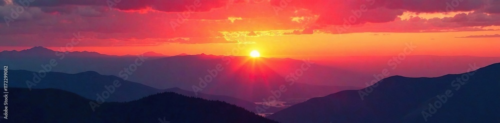 Warm hues of orange and red dance across the sky above the mountains at sunset, natural, red Warm hues of orange and red dance across the sky above the mountains at sunset, natural, red