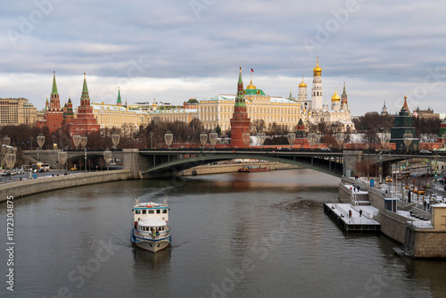 Grand Kremlin Palace, the Annunciation Tower and the ensemble of the Kremlin Cathedral Square against the background of the Large Stone Bridge over the Moskva River, Moscow, Russia