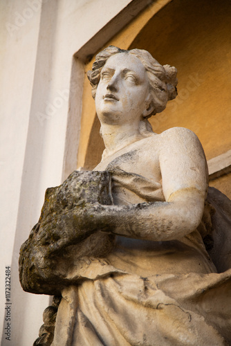 Baroque statues adorning the façade of an ancient royal palace, timeless artistry and architectural elegance captured photo