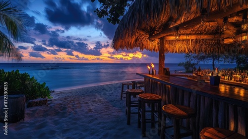 Fototapeta Naklejka Na Ścianę i Meble -  Tropical beach bar at sunset with tiki torches and ocean views 