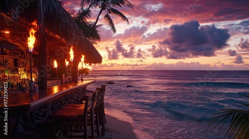 Fototapeta Naklejka Na Ścianę i Meble -  Tropical beach bar at sunset with tiki torches and ocean views 