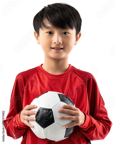 Smiling child in red shirt holding a soccer ball Isolated on transparent background