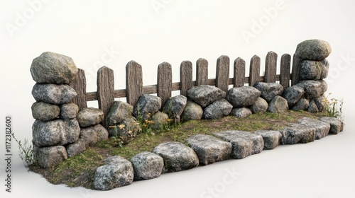 Neatly arranged foundation stones with wooden fencing and overgrown grass create a rustic garden landscape design. photo