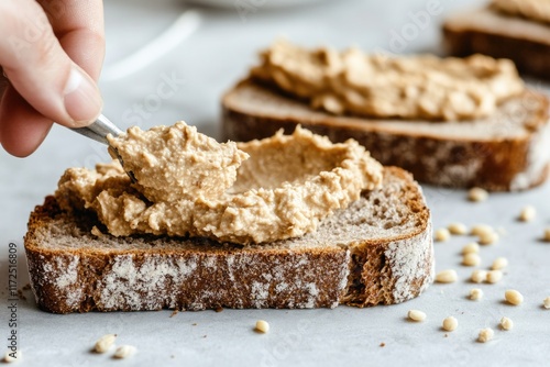 Creamy spread on rustic bread showcases delicious breakfast opti photo