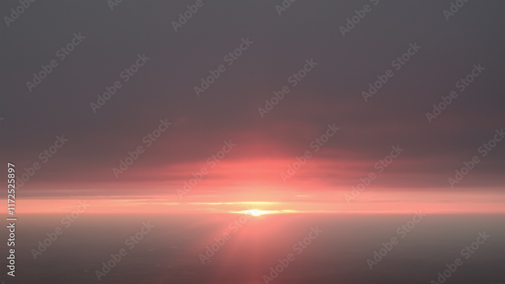 beautiful pink sunrise over clouds as seen fron an airplane beautiful pink sunrise over clouds as seen fron an airplane