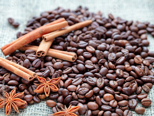 Obraz na płótnie Exploring the rich aromas of roasted coffee beans and spices on a textured surface w salonie
