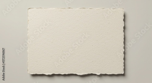 Blank Textured Paper Card with Deckled Edges on Beige Background
