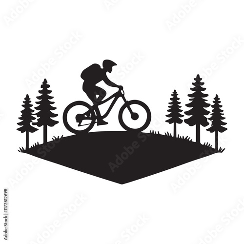 Mountain Biker Silhouette in a Pine Forest Landscape