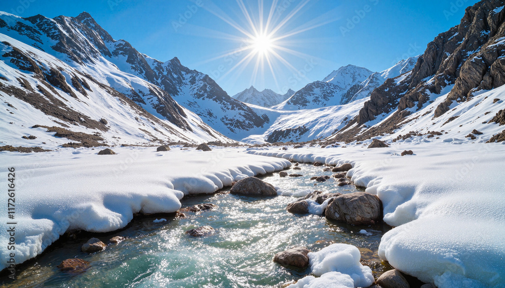 Obraz premium Snowy mountain landscape with stream under bright sunlight