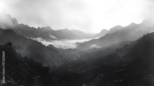 12. Scenic view of mountains and valleys draped in a soft mist during early morning hours photo