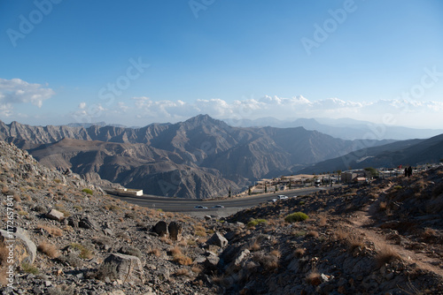 Jebel Jais, the UAE's tallest peak, offers breathtaking views, thrilling ziplines, and cool weather. A serene retreat for adventurers and nature lovers with stunning sunsets. photo