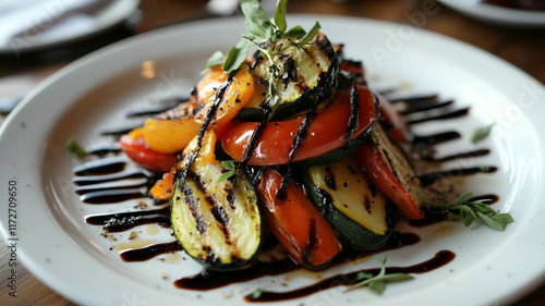 Grilled vegetables arranged beautifully on plate, drizzled with balsamic glaze, showcasing vibrant colors and textures. delightful dish for healthy eating