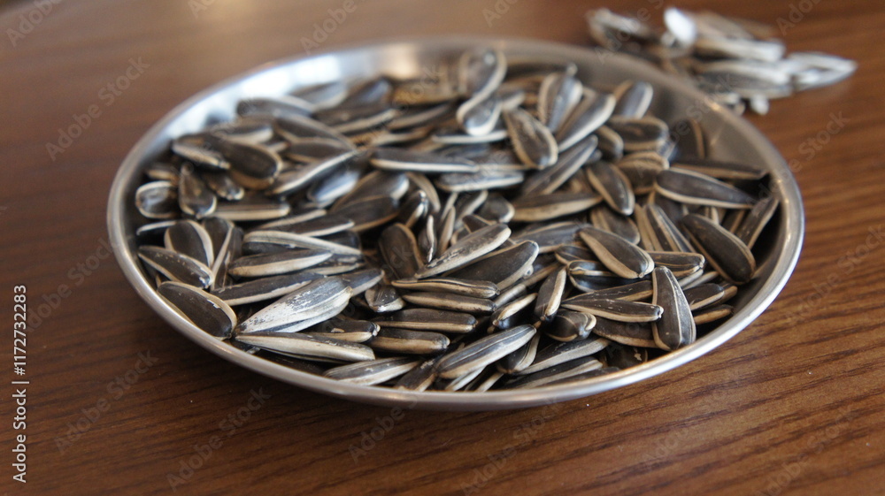 Close-up of Roasted Sunflower Seeds in a Metal Bowl Close-up of Roasted Sunflower Seeds in a Metal Bowl