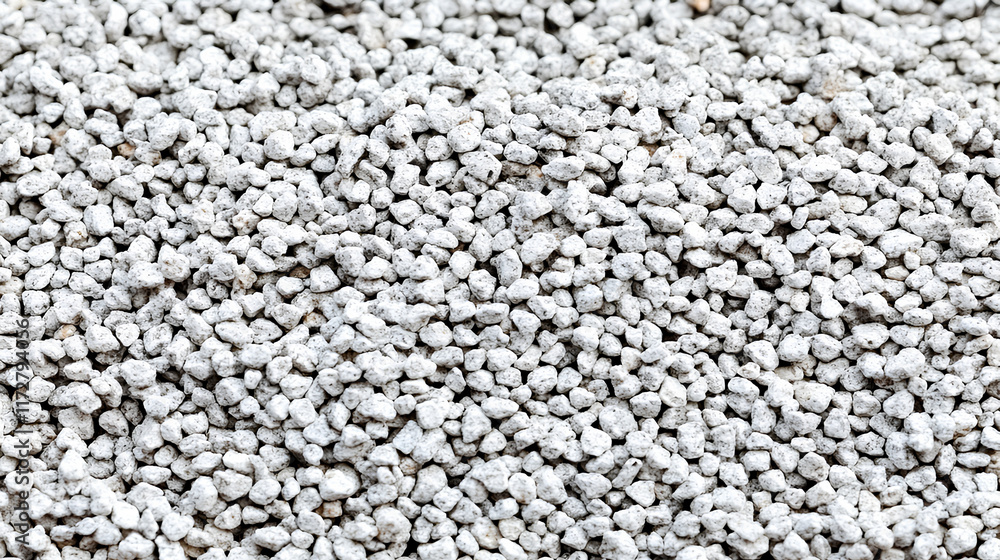 Crushed gray gravel showcasing various textures and sizes at a construction site in bright daylight Crushed gray gravel showcasing various textures and sizes at a construction site in bright daylight
