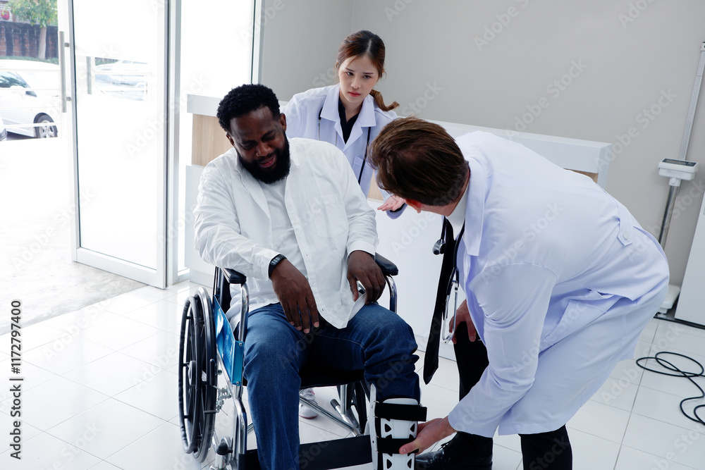Doctors care for a patient with a broken leg in a wheelchair. Doctors care for a patient with a broken leg in a wheelchair.