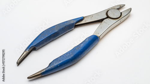 A pair of slip-joint pliers with slightly aged steel and a blue rubberized handle, laying flat on a bright white background with subtle shadows. photo