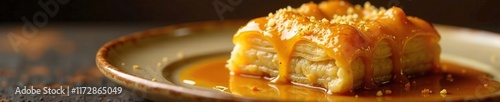 Golden syrup dripping from a piece of baklava, sweet, honey, syrupy