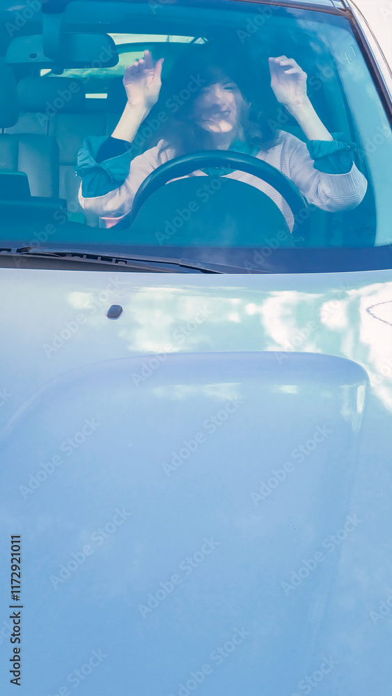 Frustrated businesswoman stuck in traffic, expressing anger while driving