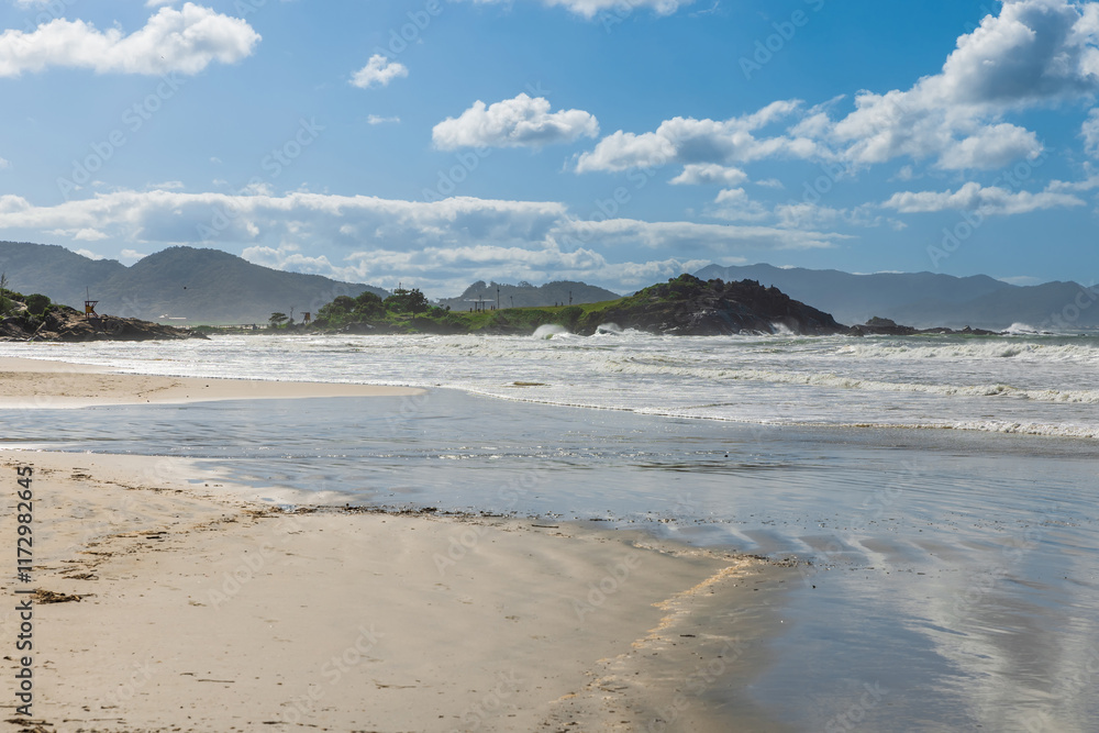Coastline with rocks, beach and ocean with waves in Brazil. Matadeiro Beach in Florianopolis Coastline with rocks, beach and ocean with waves in Brazil. Matadeiro Beach in Florianopolis