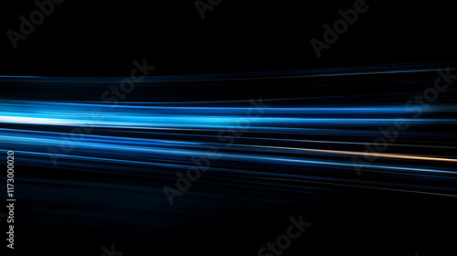Abstract blue light streaks on black background.