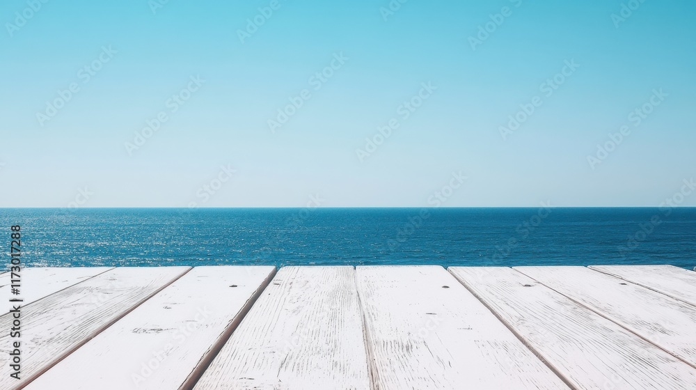 Fototapeta premium Tranquil Ocean View from Wooden Deck Under Clear Blue Sky