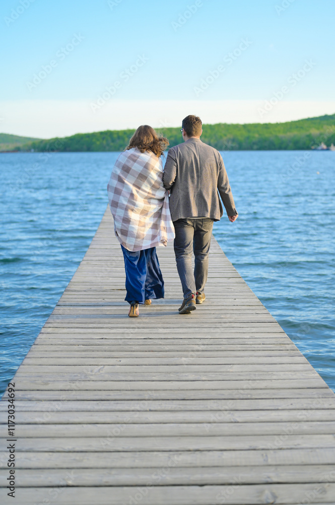 A man and a woman go into the distance of the sea A man and a woman go into the distance of the sea