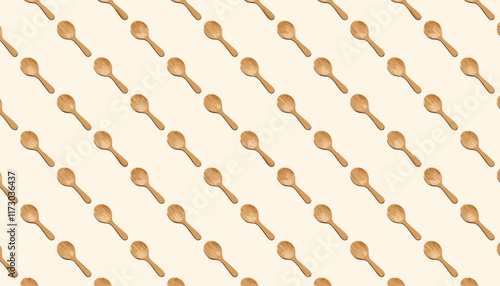 Seamless pattern with wooden spoons on beige background.