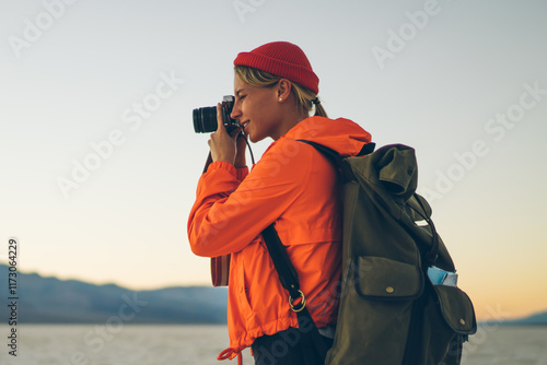 Focused woman taking pictures of nature