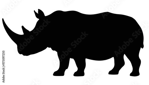 Majestic silhouette of a rhinoceros standing in the wilderness at dusk