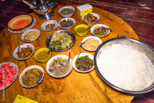 Burmese food a large set (Burmese food) Soup, shrimp paste, and various curries are placed all over the table at a merit-making ceremony. photo