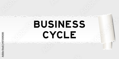 Ripped gray paper background that have word business cycle under torn part