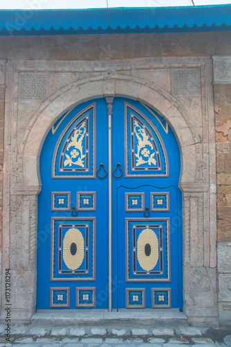 Traditional door in the streets of the medina of Tunis photo