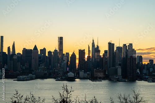 NYC skyscrapers in silhouette stunning morning light, city scape water reflection, background image, world famous destination