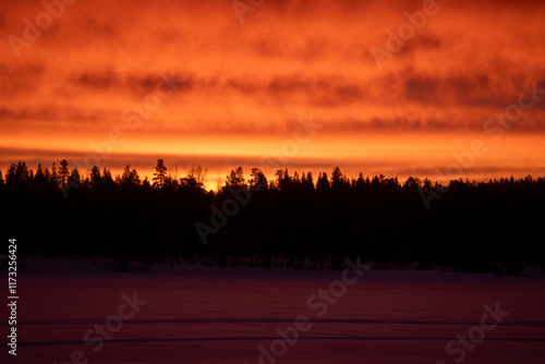 Red sunrise at noon in Lapland Inari Nellin Lake photo