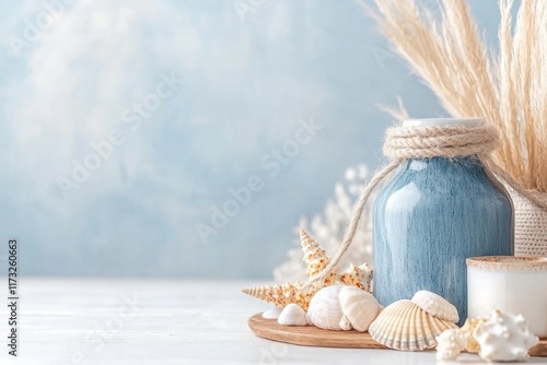 A coastal-inspired kitchen with blue cabinetry, white countertops, and nautical decor such as ropes and seashells