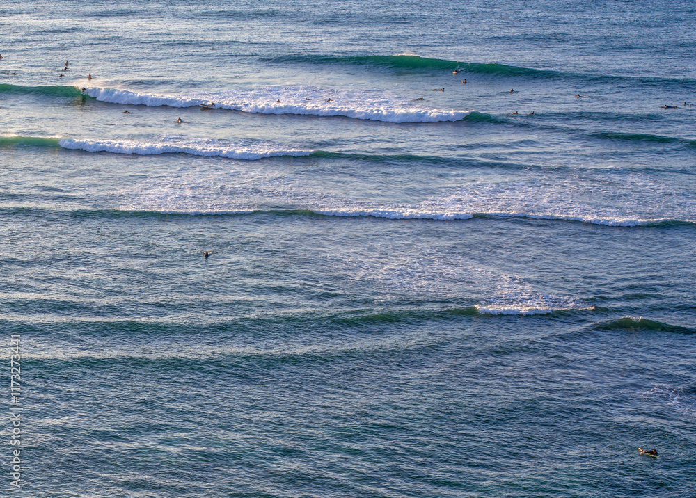 Fototapeta premium Surfers viewed from near Diamond Head Lighthouse in Honolulu, Hawaii.