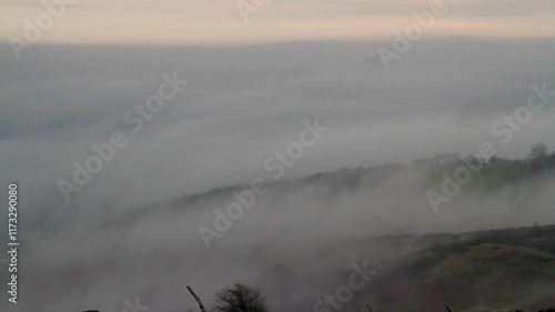 Clee Hill geen moor near Ludlow, Shropshire, looking across at a temperature inversion, low clouds or water vapour, landscape. Telephoto