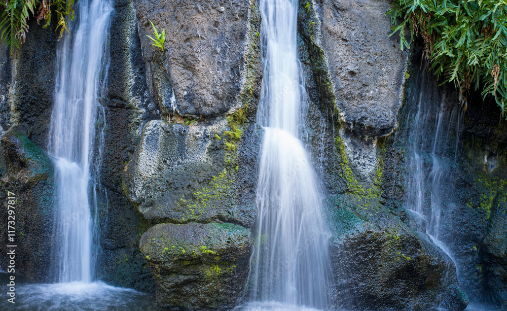 Fototapeta premium Tropical Waterfall with Black Lava Rock Background.
