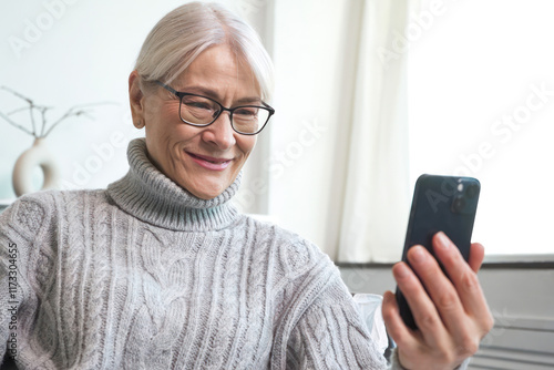 Senior woman enjoying a casual video call on her smartphone