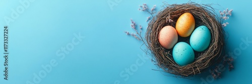 Easter Eggs in a Nest on a Light Blue Background