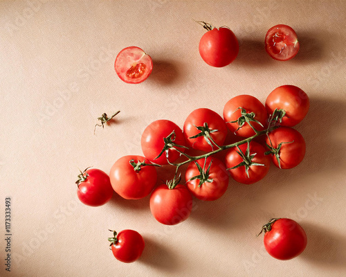 Food background flat lay, light and shadows, tomatoes strewn on a beige kitchen table photo