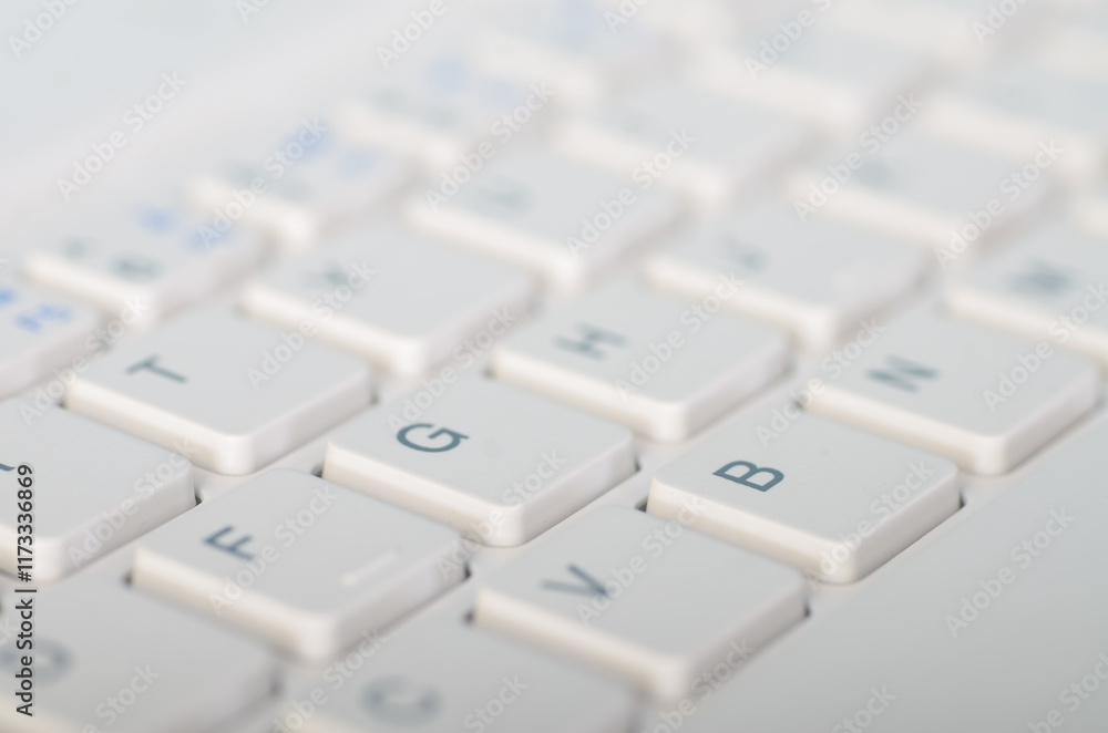 Close-Up of a White Computer Keyboard with Visible Keys Close-Up of a White Computer Keyboard with Visible Keys