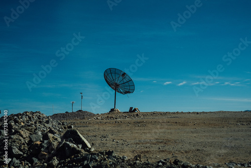 Large satellite dish in a remote desert landscape, Chile photo