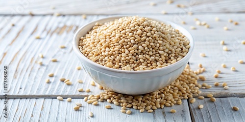 Macro Photo: Decorticated Sesame Seeds in White Bowl on White Wood photo