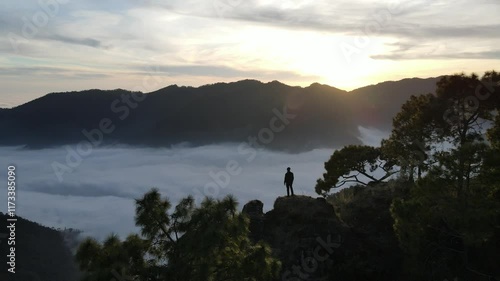 silhouette of a person in the mountains
