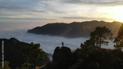 silhouette of a person in the mountains