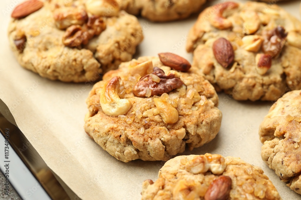 Tasty cookies with nuts in baking tray, closeup Tasty cookies with nuts in baking tray, closeup