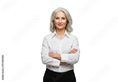 A confident woman with silver hair wearing a white shirt and black pants arms crossed, smiling softly isolated on transparent background